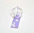 Handcrafted Japanese purple magnolia glass furin wind chime on a white background.