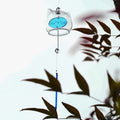 Close-up of a handcrafted Japanese glass cat furin wind chime featuring an adorable blue kitten design.