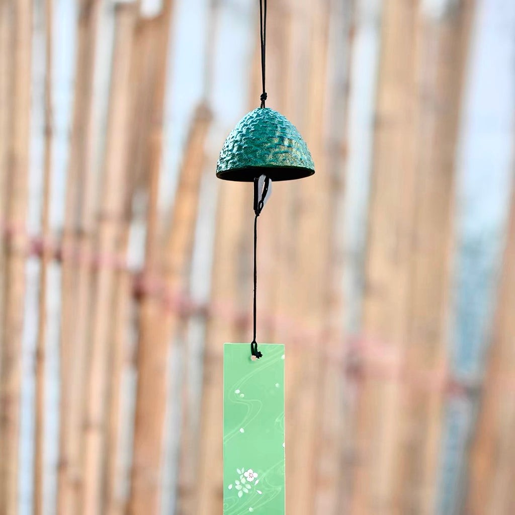 Japanese green cast iron pine cone wind chime hanging with a tanzaku paper strip