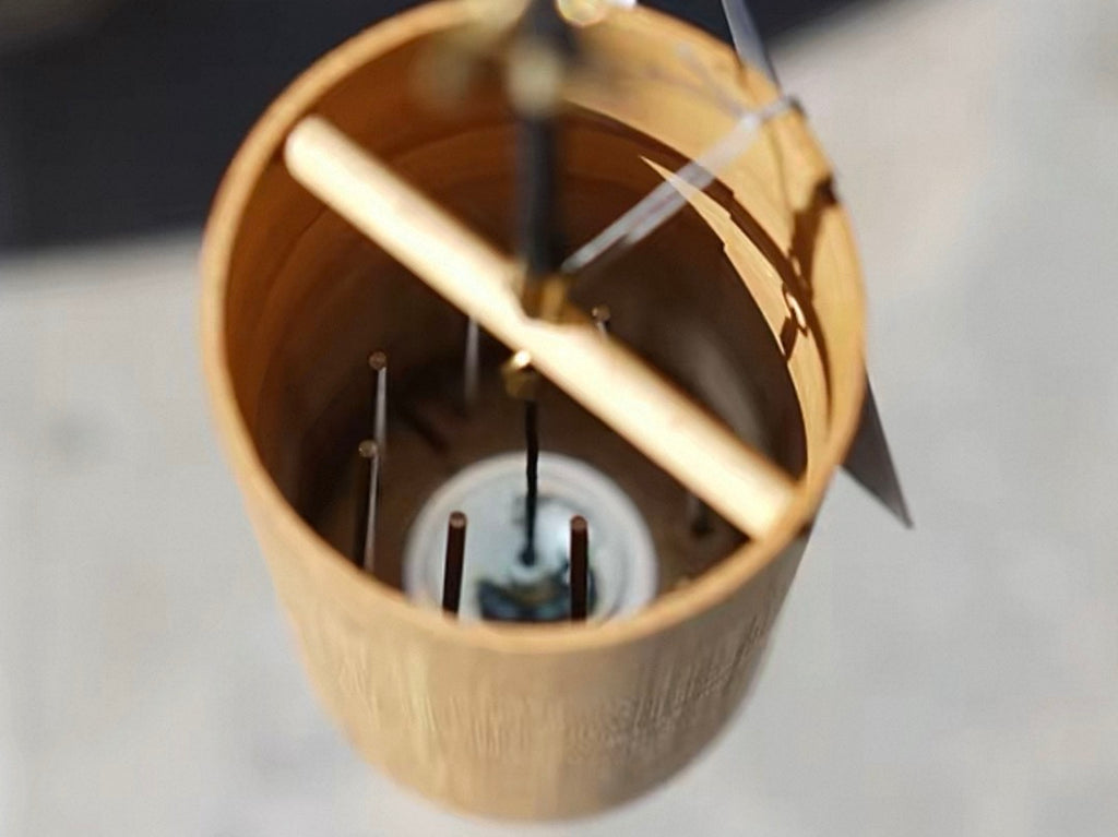 Inside detail of a Japanese bamboo wind chime showing the inner chime structure and natural bamboo texture.